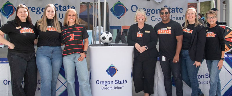Oregon State Credit Union group posing at Oregon State University Dam Proud Day 2026