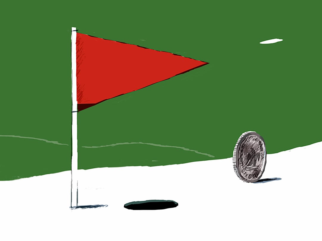 golf hole with a coin rolling into it