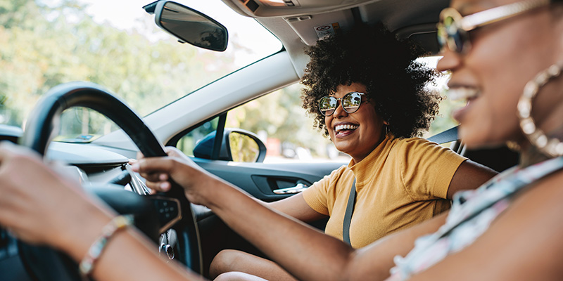 two women driving car