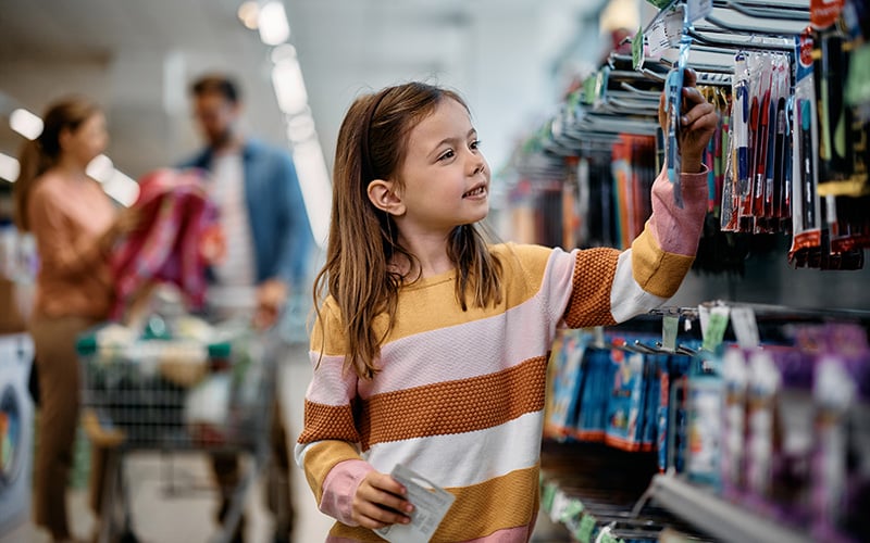 girl shopping for back to school supplies