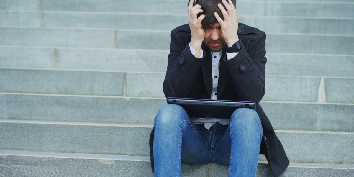 frustrated man on steps