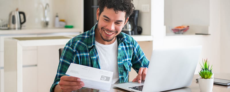 man paying bills online